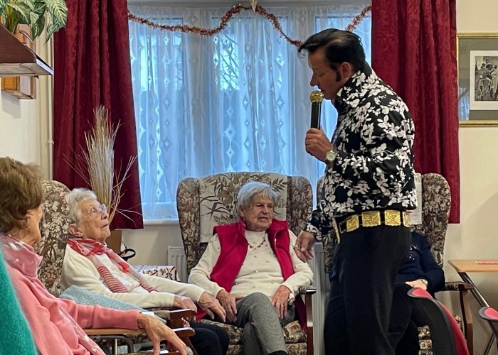 Elvis (Andy King) entertaining JUST FRIENDS NEWHAVEN members at their Tea Party on 4th December 2023.